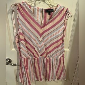 Pink and tan striped sleeveless linen blouse.